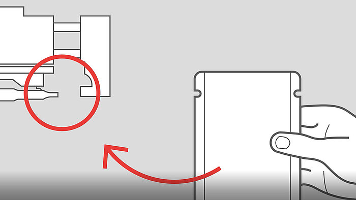 自立袋を上部封口装置にセットする図